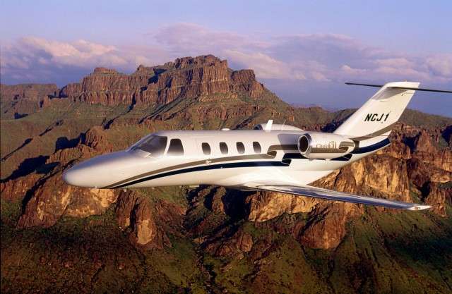 Citation CJ Above Mountains | Stratos Jets Charters, Inc.