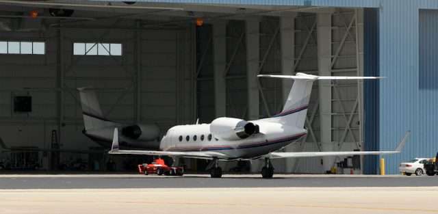 Private jet charter aircraft in a hangar