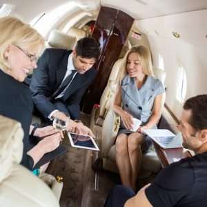 business people on a private jet charter