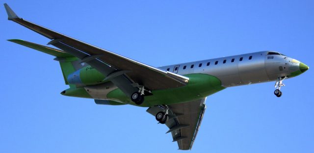 Green and White Bombardier Global 7500 Landing