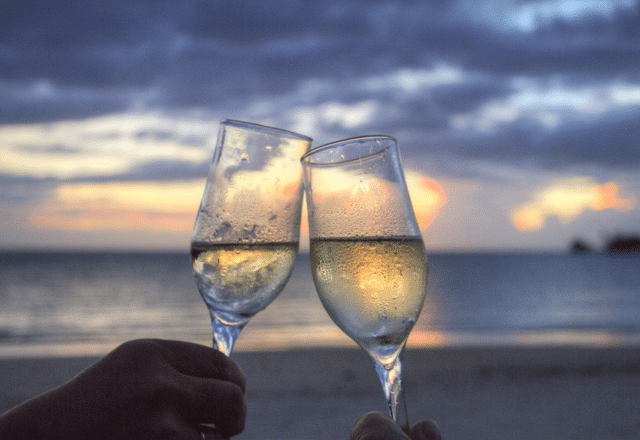 two wine glasses and sunset
