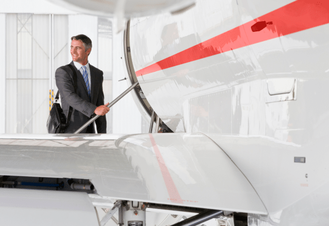 businessman boarding private jet charter