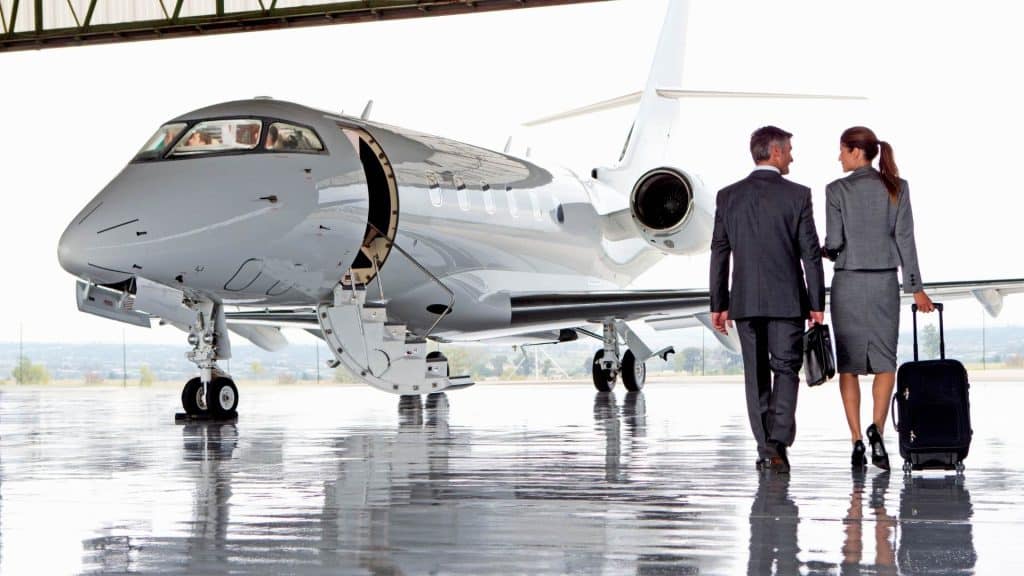 business professionals boarding private jet charter