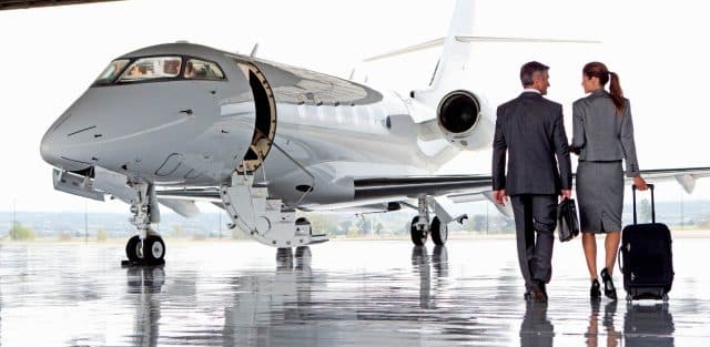 business professionals boarding private jet charter