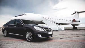 car parked beside private jet on tarmac