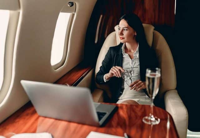 woman sitting on private jet