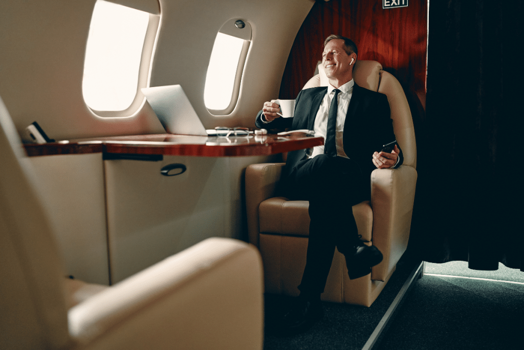 man sitting inside private jet
