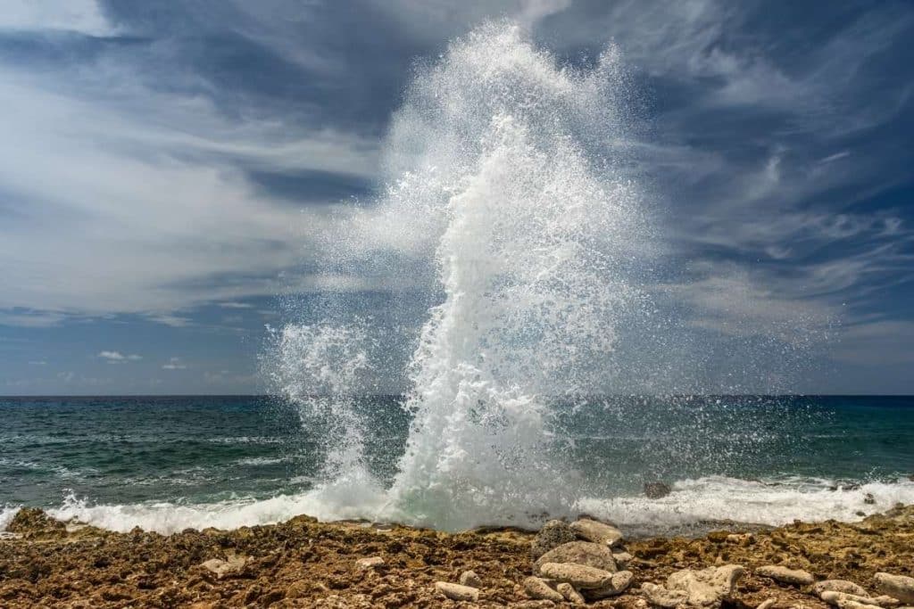 water spraying along the coast of grand cayman island