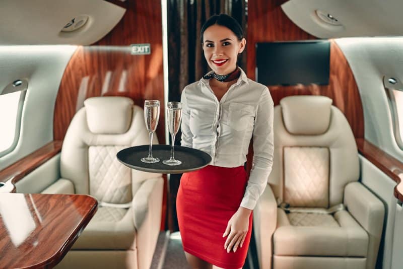A flight attendant on a private jet.
