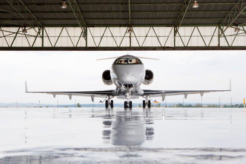 A private jet in a hangar.