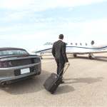 A private jet fractional ownership investor walks towards their aircraft