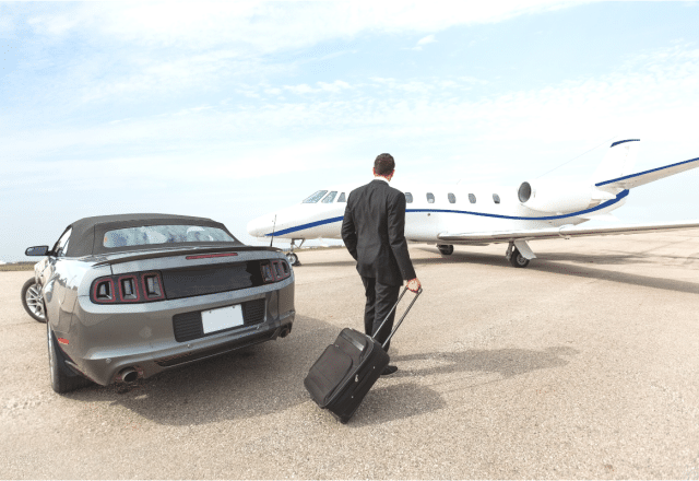 A private jet fractional ownership investor walks towards their aircraft