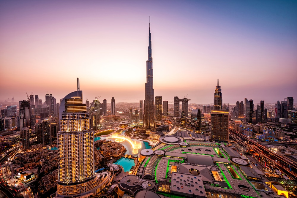 Dubai's skyline comes alive at dusk as the Burj Khalifa towers over the dancing fountains.