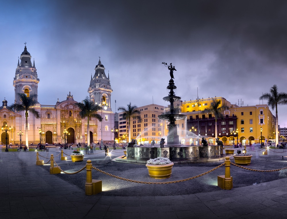The Plaza de Armas in Lima, Peru comes alive at night with faint and beautiful glowing lights.