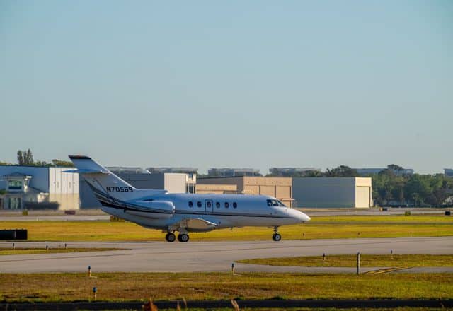 A Hawker 800XP sits on an airport runway.