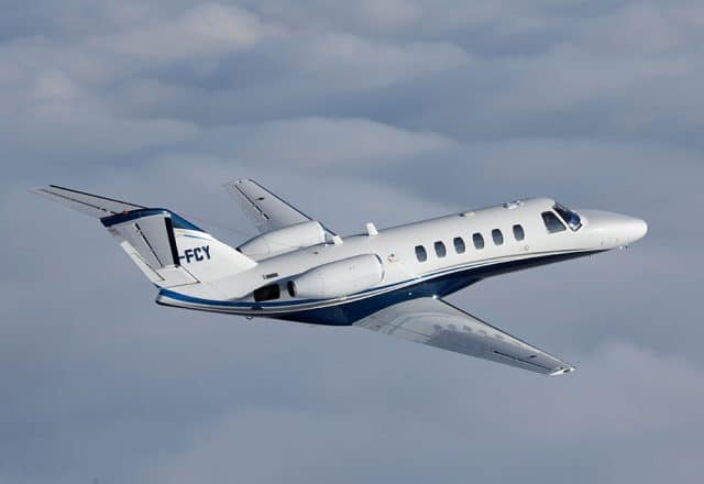 A Cessna Citation private jet in flight.