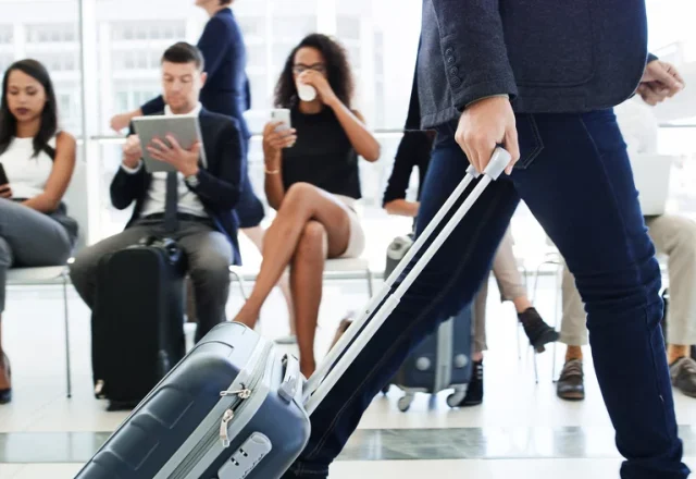 A man walking through a busy airport
