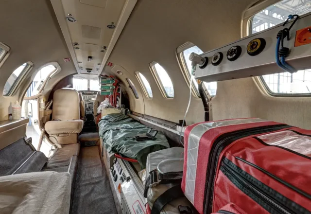 An interior view of a private jet ambulance cabin.