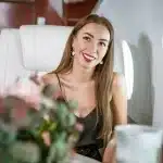 A beautiful woman sitting in a private jet.